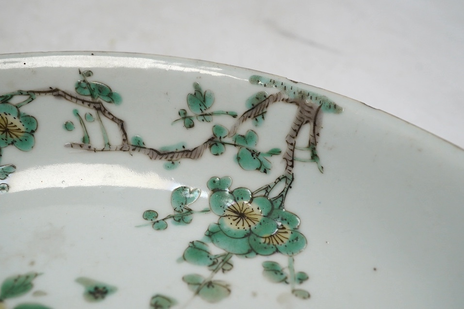 A Chinese famille verte dish, Kangxi period, 21cm. Condition - rim chips, otherwise fair